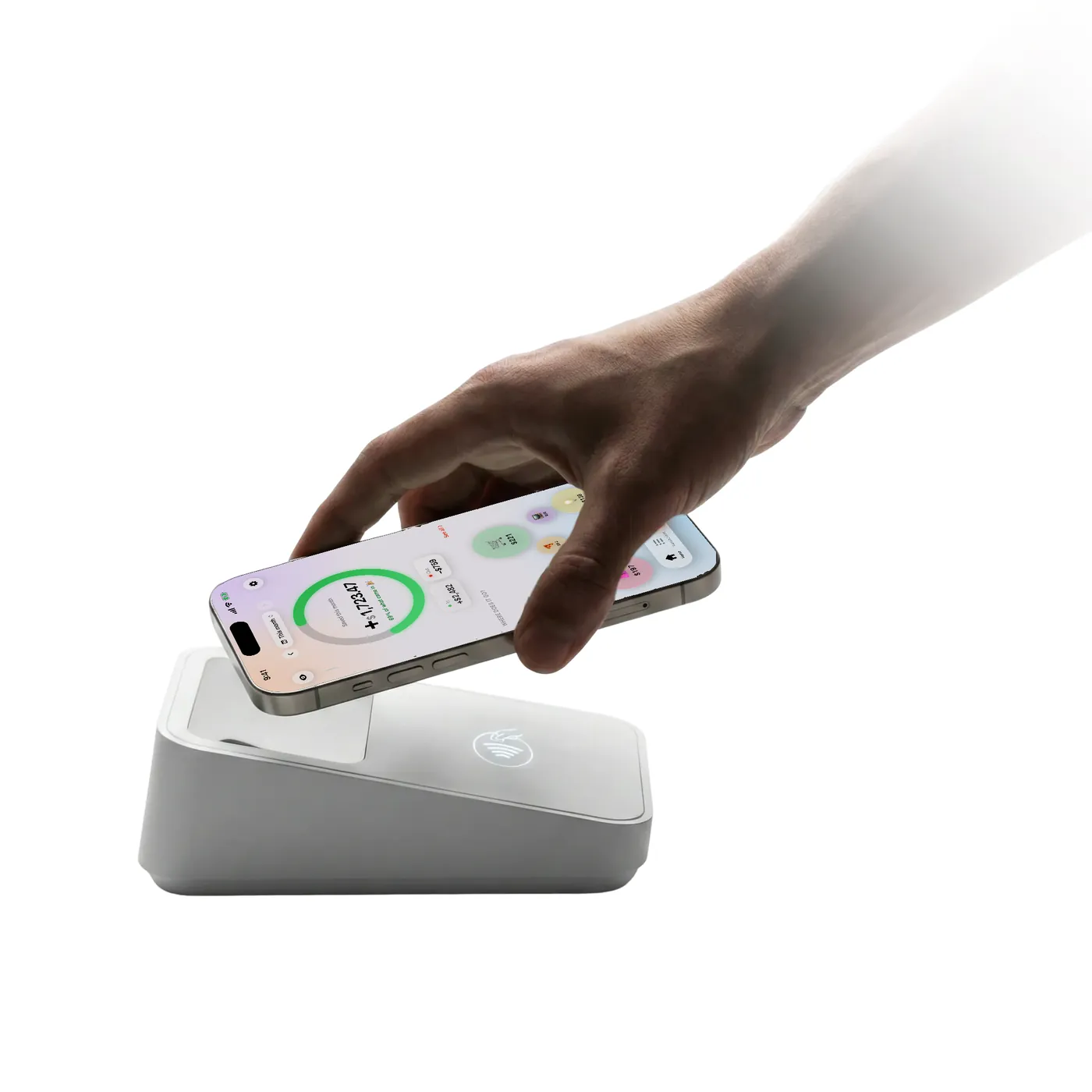 A hand holding an iPhone with Countey open over a card reader.